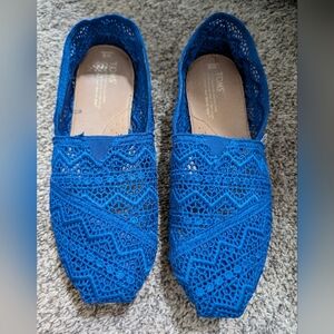 Blue TOMS slip ons